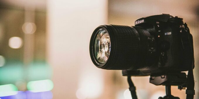black Nikon DSLR camera focus photo