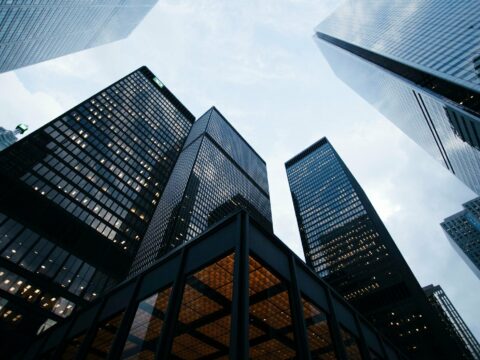 low angle photo of city high rise buildings during daytime